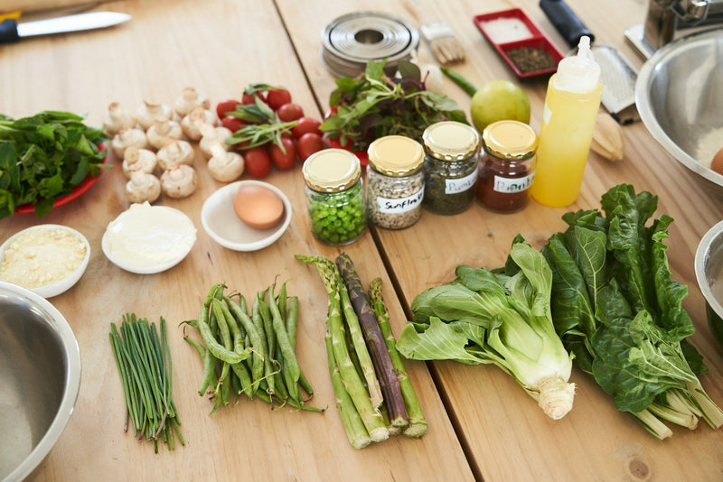 Fresh ingredients and spices arranged on a wooden table