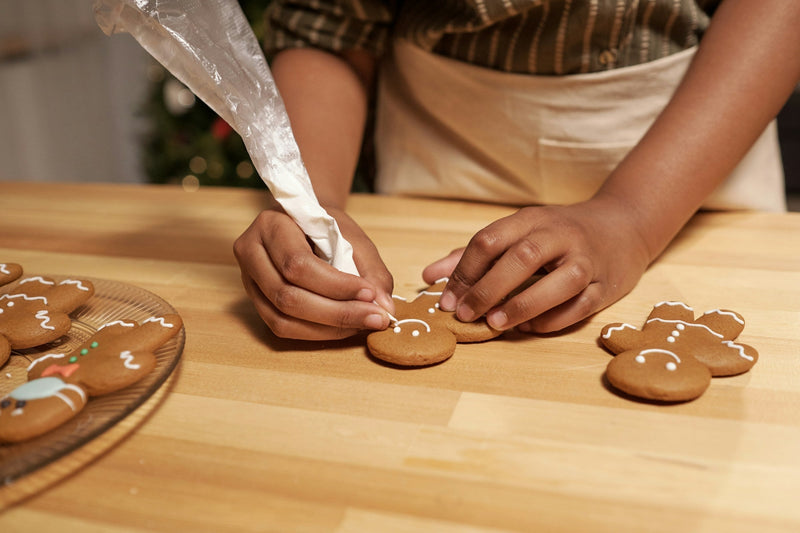 Baker decorating cookies in a ghost kitchen environment