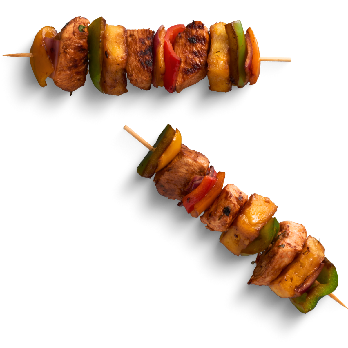 Skewers with grilled chicken, bell peppers, and pineapple on wooden sticks

